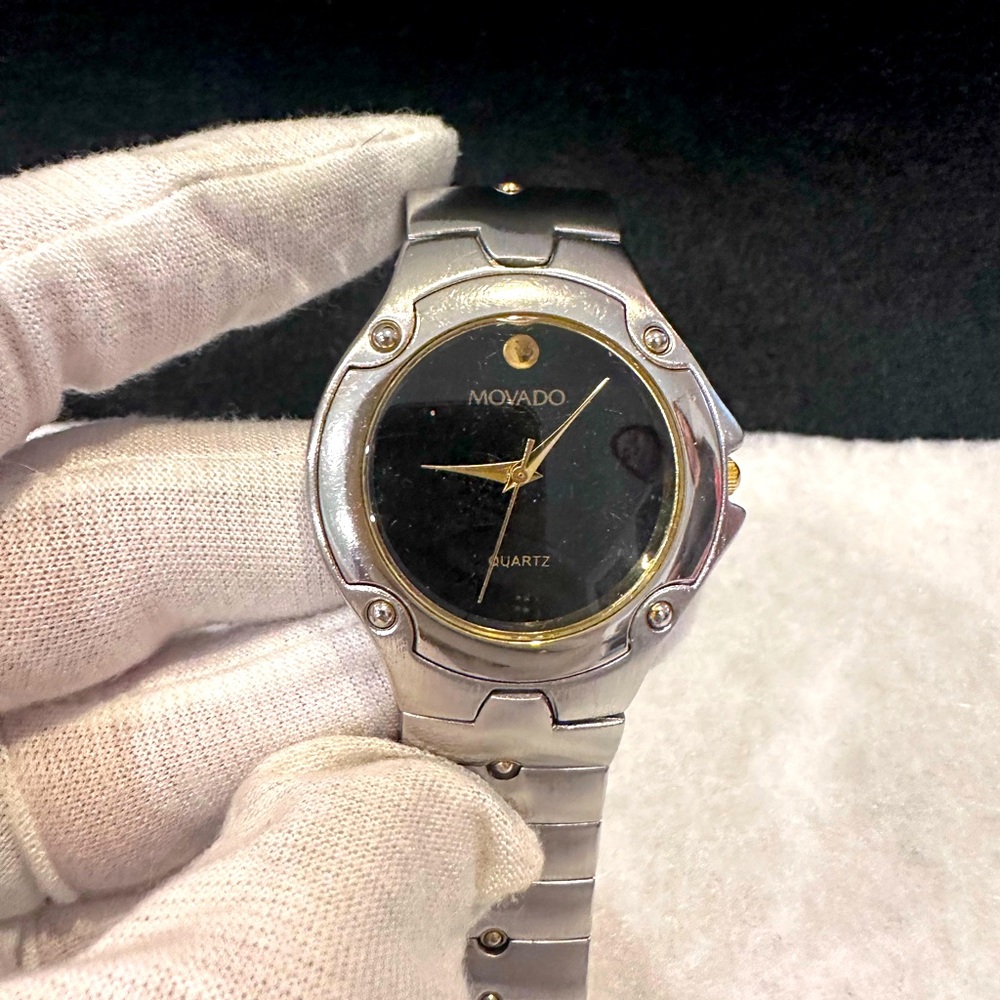 Movado Men's Silver and Black Watch with Gold Accents